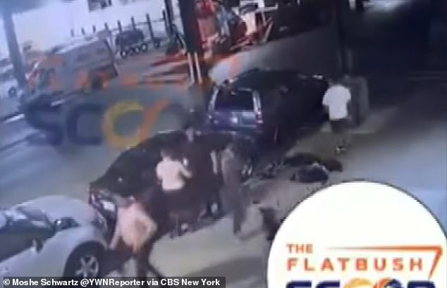 Seven men emerge from open manhole in Brooklyn street