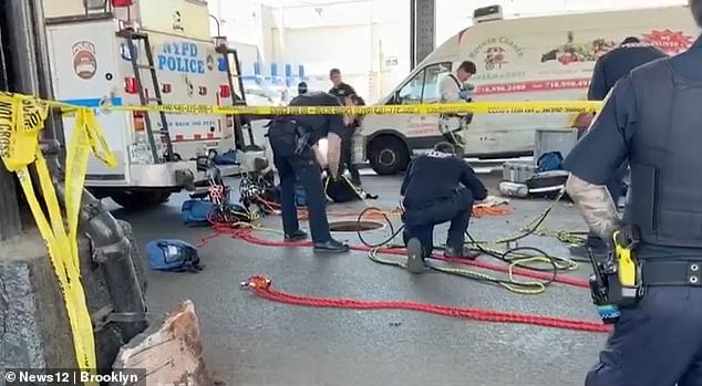Seven men emerge from open manhole in Brooklyn street