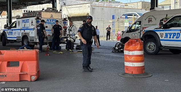 Seven men emerge from open manhole in Brooklyn street